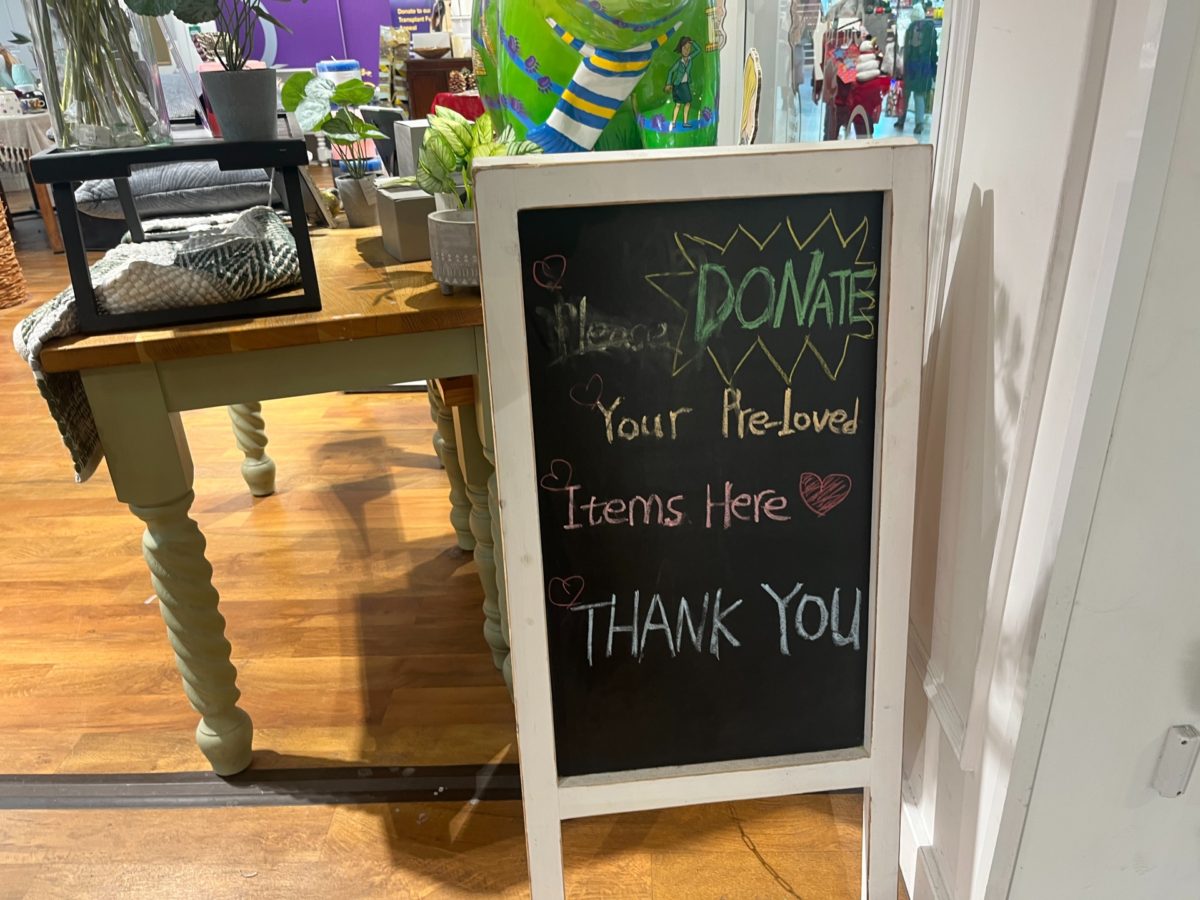 Pre-loved sign inside the charity shop