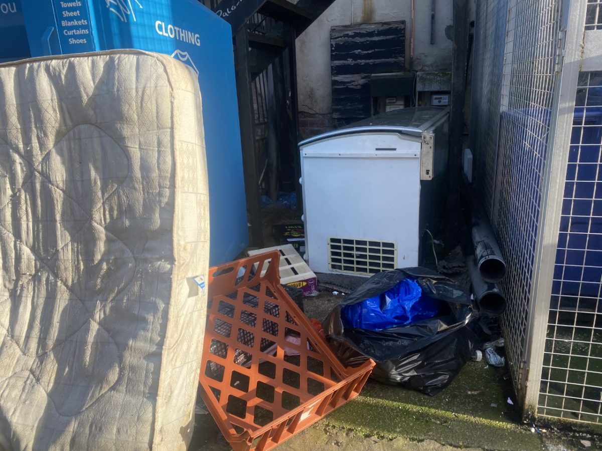 rubbish dumped outside house