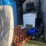 rubbish dumped outside house