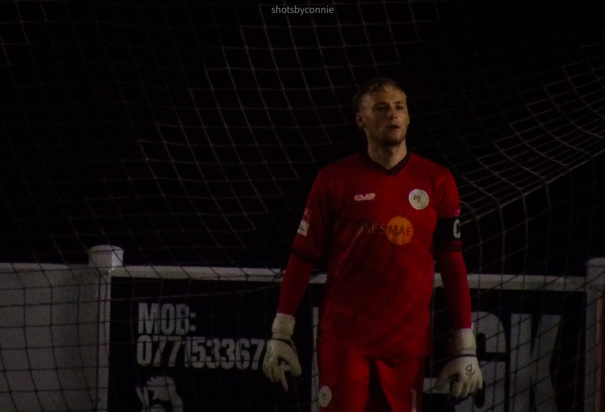 man in red shirt walking