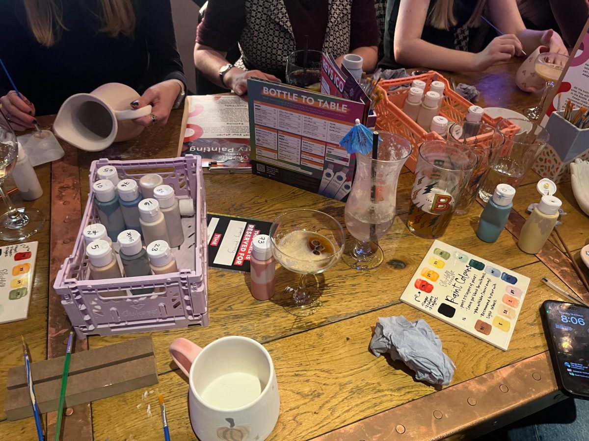 Table with pottery painting and drinks