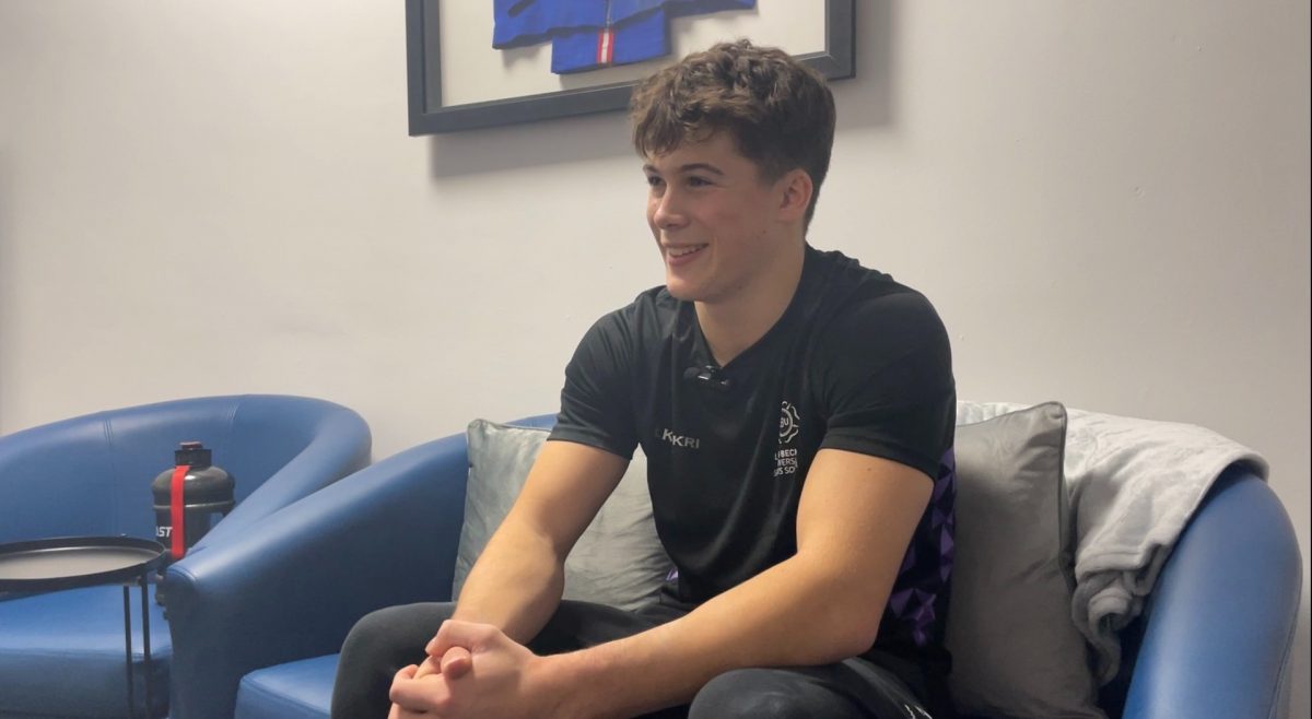 Connor Sullivan sat down being interviewed with slight smile.