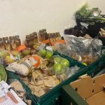 A box full of a variety of food being prepared to give to foodbank users