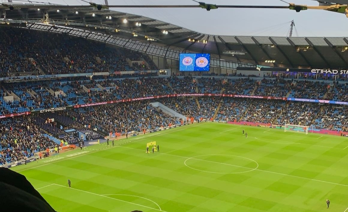 A photograph of Manchester city football stadium, taken from a high angle.