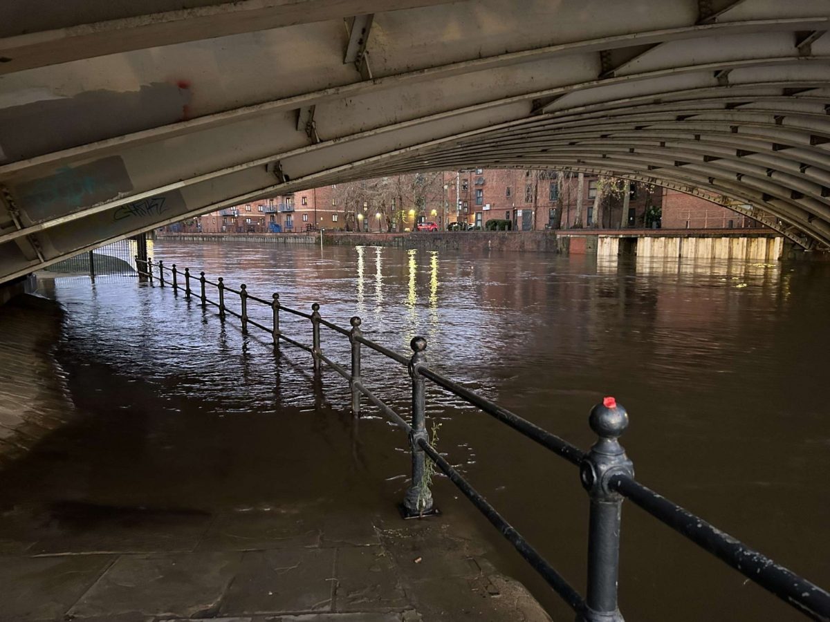 An image of a flooded river in the dark.