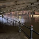 An image of a flooded river in the dark.