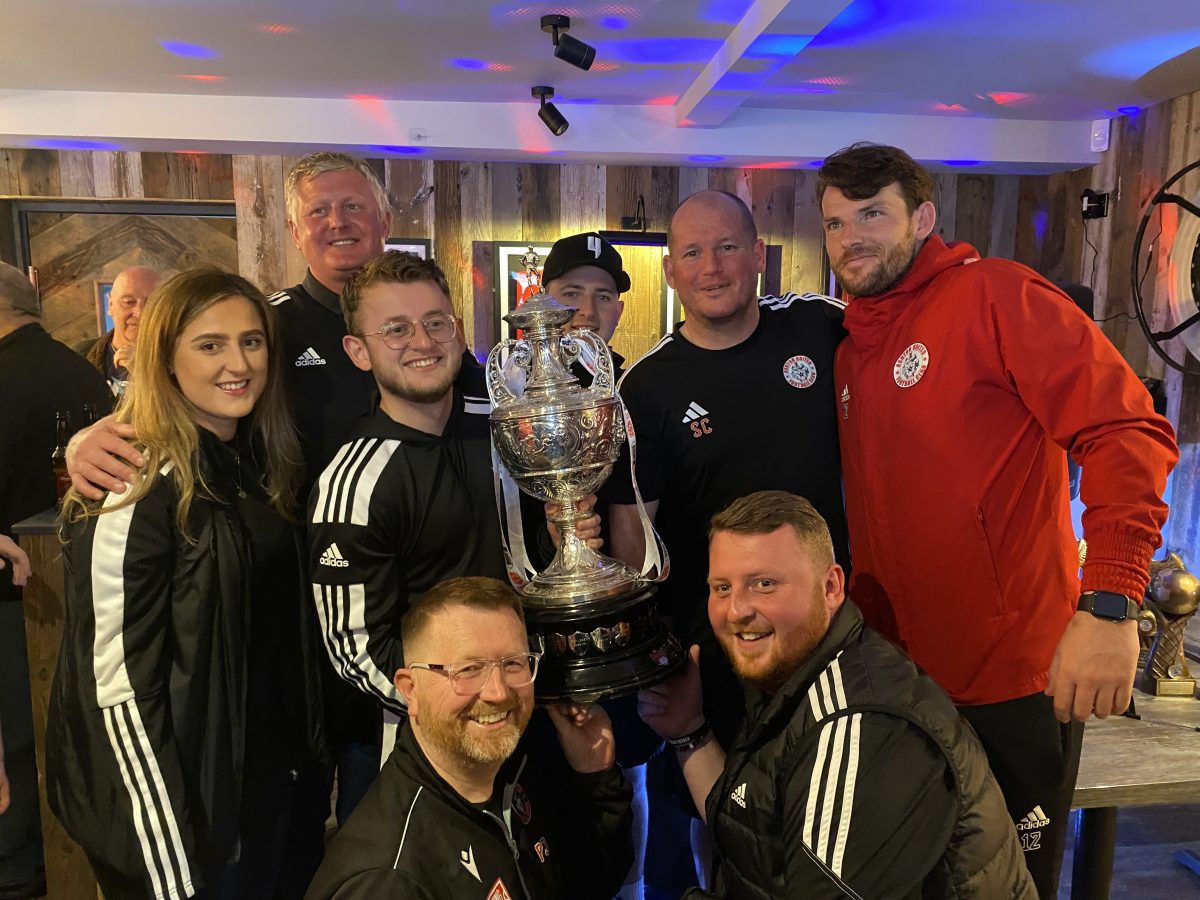 Management team with trophy