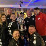 Management team with trophy