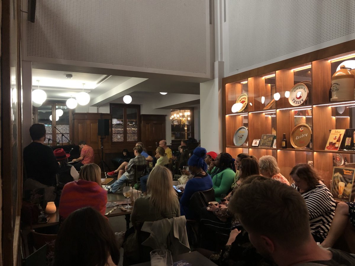 Man playing piano in the Tetley