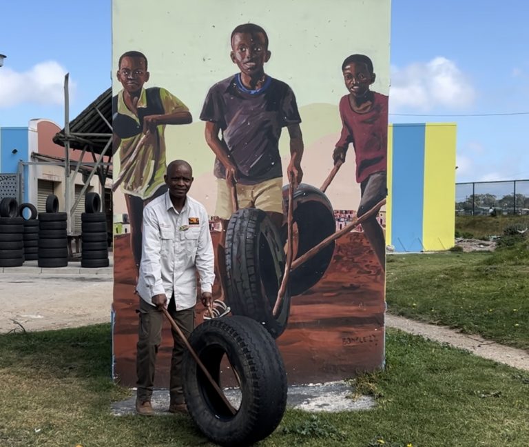 Zhanim Vulah, man living in Walmer Township showing what children use to play with.