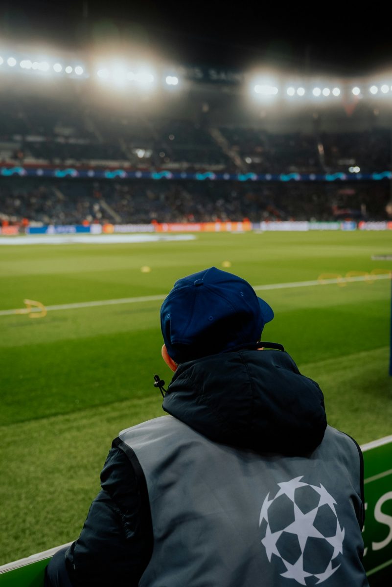 A person sitting on the bench as a ball boy