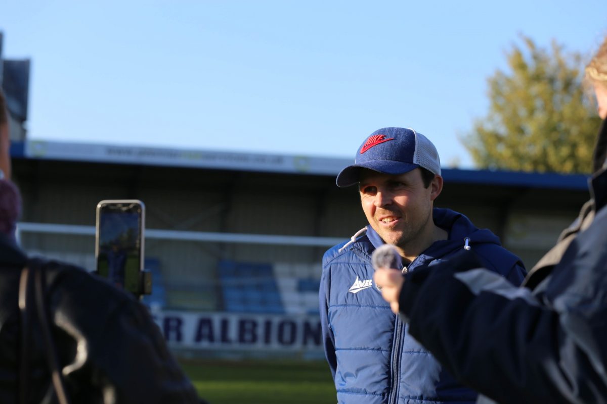 Head coach rob mitchell being interviewed