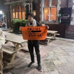 Picture of Youth Demand member holding sign