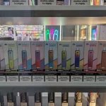 A shop window displays many flavored disposable vapes set to be banned in 2025