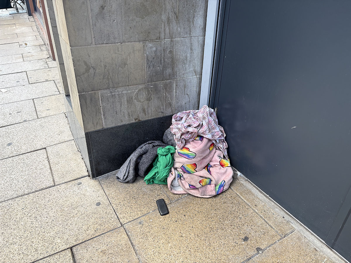 Discarded bedding by the side of the road