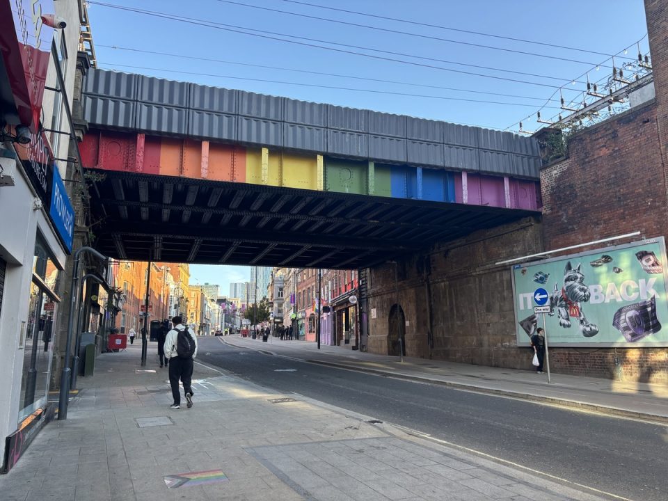 A quiet look to Lower Briggate, the rainbow railway bridge over the street home to Under the Arches