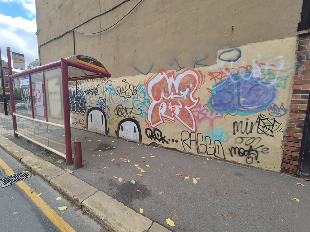 A wall with graffiti on it