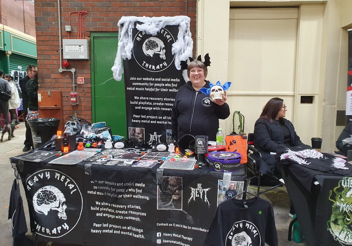 A Woman in front of her stall at the goth market