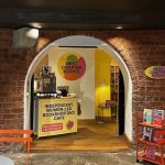 Entrance to Next chapter books, an independent women-led bookshop and cafe in Leeds