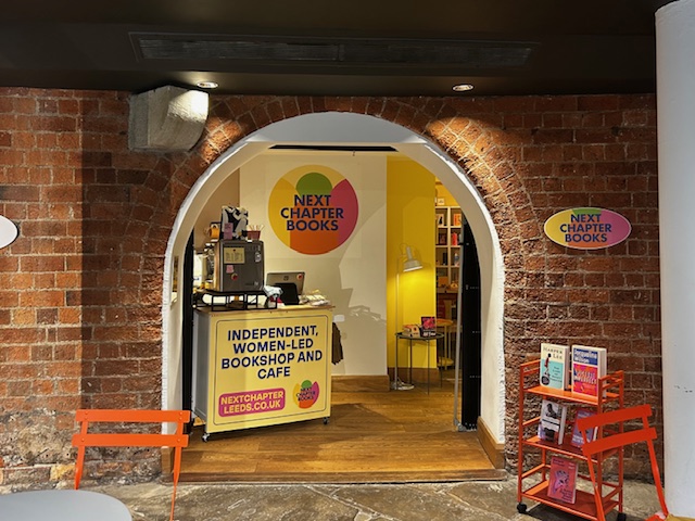 Entrance to Next chapter books, an independent women-led bookshop and cafe in Leeds
