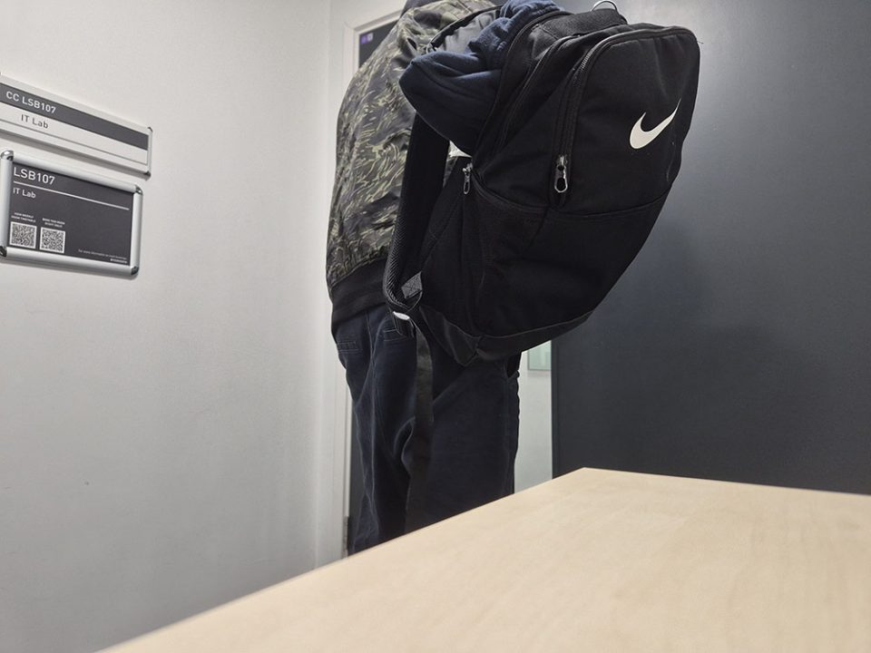 A recreation of a shoplifter walking away with their stolen hoodie.