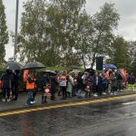The image shows the GMB union picket line in the rain outside Airedale Hospital