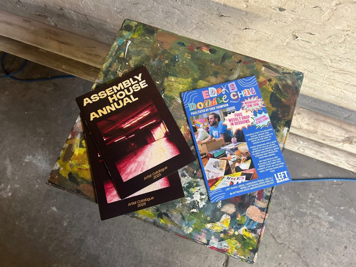 image of two leaflets sitting on a painted marbled stool.