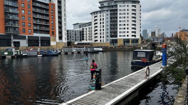 Leeds dock with paddleboard setting off