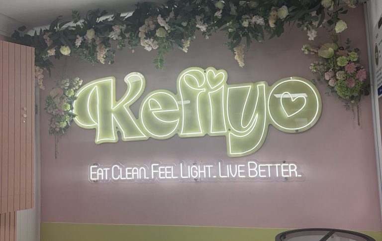 Kefiyo sage green sign inside the store