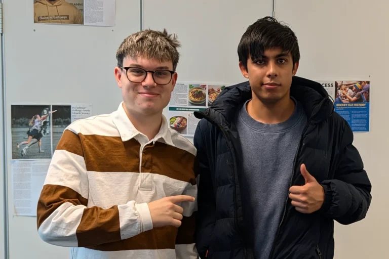 Two students looking at the camera.