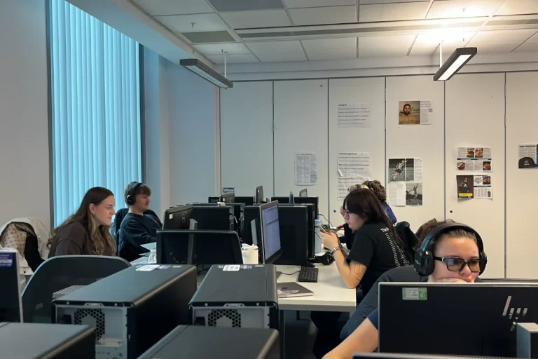 Newsroom with people working